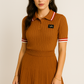 Conjunto polo tejido en canalé  con falda plisada mujer