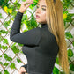 Blusa larga al cuerpo cuello alto